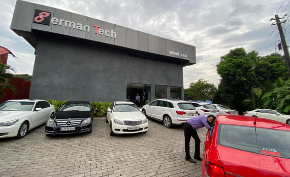 Red car in front of German Tech showroom Kottayam